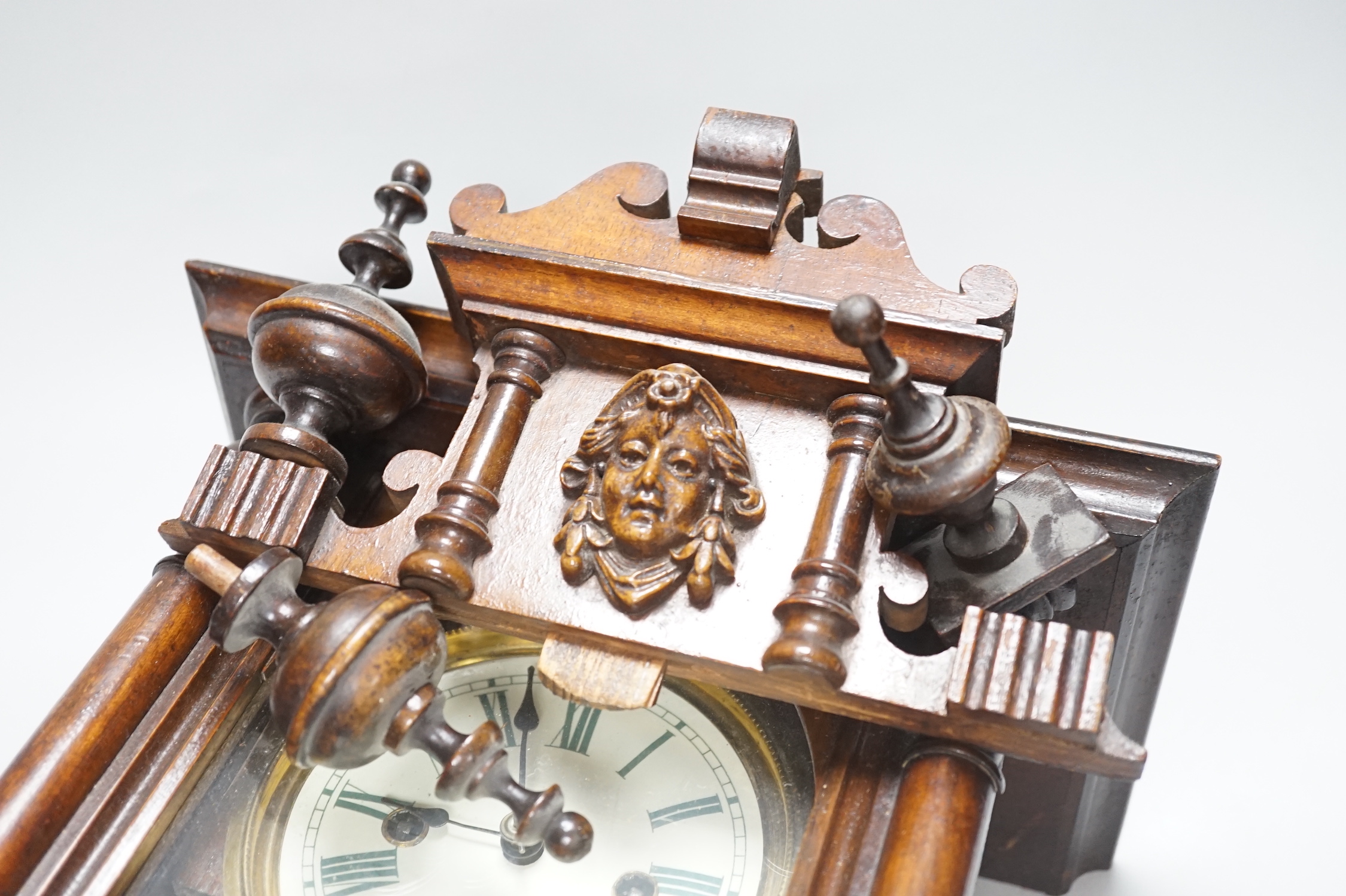 A small mahogany Vienna wall clock, 57cm high